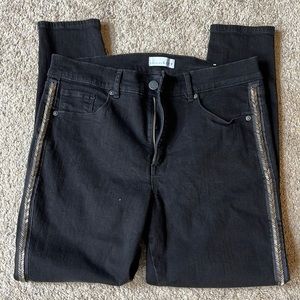 Black loft skinny jeans with embellishments down the side.